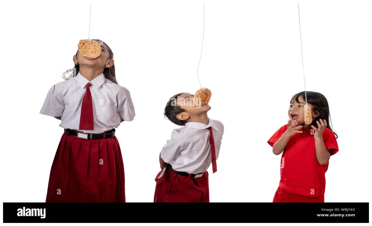 lomba makan kerupuk Stock Photo - Alamy